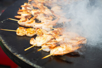 Street food fried shrimps for hot dogs with seafood