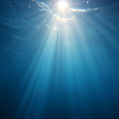 Obraz premium Sunlight Filtering Through Ocean Water with Rays and Particles Visible