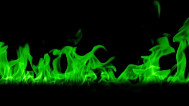 Magical Green Fire. Green Fire burning. Bright burning flames on a black background. Fire in slow motion. Wall of Real fire, abstract background. Super slow motion video