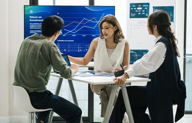 team of financial discussion business planning, analyzing digital financial data and strategy in a modern office