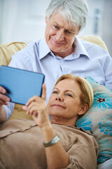 Old couple, tablet and streaming to relax in home, watching movie and retirement bonding on sofa. Senior people, online subscription and website for blog on weekend, comfort and peace in marriage