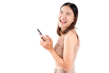 Happy and excited young woman using mobile phone standing over isolated on white background and copy space Young girl using smartphone for shopping online chat and texting message She get surprised	
