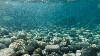 Pebble beach seen from the water.