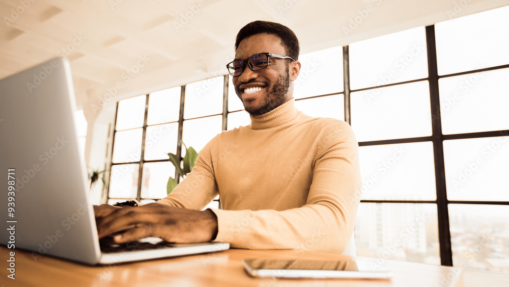 Aufkleber Writing A Blog Post. Satisfied afro blogger uploading photos, updating account information. Free space