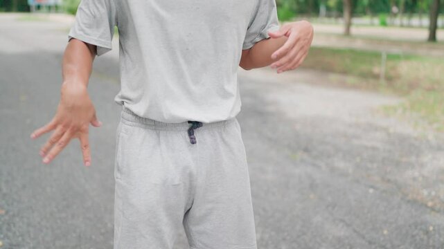 Man warm-up preparations before training athlete sportive lifestyle exercise, sportsman wellbeing recreation health longevity stadium city outdoors physical activity cardio.
