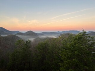 Serene early morning view of rolling hills and misty valleys in the Appalachian Mountains at sunrise