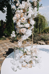 Element, part of wedding arch decorated with flowers, standing on podium, stand outdoors not ceremony. Photography, design concept at celebration.
