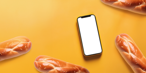 Template de telefone celular com tela vazia. Smartphone com tela transparente e sem fundo, sobre fundo amarelo visto de cima ao redor de vários pães