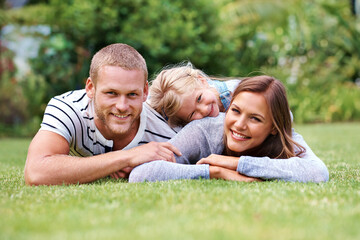 Family, girl and portrait for peace on grass, love and security in childhood or outdoor happiness. Daughter, mother and father for support in relationship, connection and countryside holiday to relax