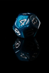 a two-toned blue twelve-sided D12 dice with white numbers showing the number four, on a black background with a reflection