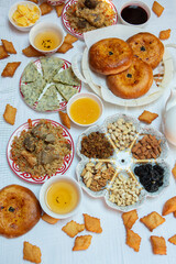 Meal with traditional Kyrgyz dishes served in the yurt. Local food in Kyrgyzstan.