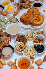 Meal with traditional Kyrgyz dishes served in the yurt. Local food in Kyrgyzstan.