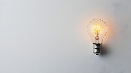Minimalist light bulb isolated on a clean white background representing a creative idea innovation or Concept for problem solving strategy entrepreneurship and new solutions