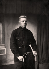 Vintage photo of a young man in typical clothing in the USSR in the 1930s. Photo from 1937