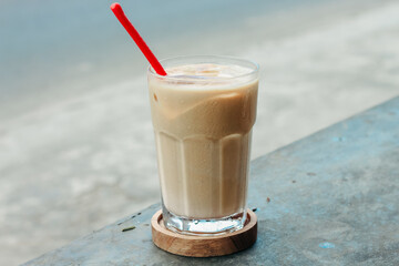 Iced cofee milk with palm sugar on the table. Eskopi gula aren pandan