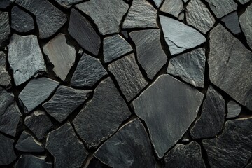 Textured slate stone surface with varying shapes and shades of gray