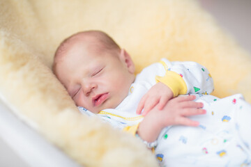 Little baby on white bed