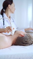 Doctor woman performing neck ultrasound exam on male patient. Medicine service concept