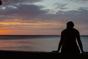 Fototapeta premium PG Island, Oriental Mindoro Province, Philippines - Silhouette of people on the beach at sunset