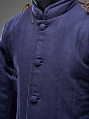 Historical fashion. Medieval knight cloth. Padded jacket gambeson.