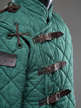 Historical fashion. Medieval knight cloth. Padded jacket gambeson.