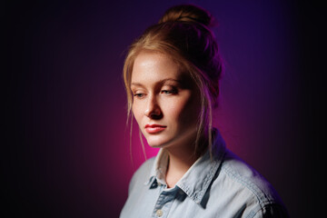 Colorful close-up studio portrait of a young woman