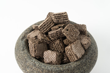 Biscuits chocolate with crumbs on white background. It is a chocolate cookies with a sweet cream.