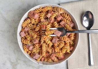 rotini  pasta with  diced spam  and seasoning