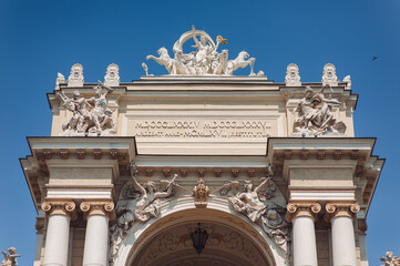 The facade and roof of the Opera and Ballet Theatre in Odessa. Sculptures of Glory, Orpheus, centaur, Terpsichore, Melpomene, panthers, mascarons and cupids. Architecture style of Viennese Baroque.