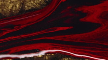 Abstract background. Ink drip. Liquid paint texture. Red burgundy black glitter particles pigment mix stream motion on gold illusion surface in creative art. - Powered by Adobe