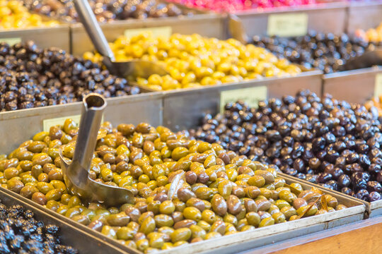 Fresh olives for sale at food market in Kadikoy District, Istanbul Turkey - Powered by Adobe