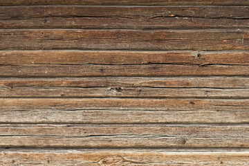 Fototapeta premium Close-Up of Weathered Wooden Log Cabin Wall