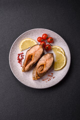 Delicious red salmon r trout fish grilled with spices and herbs