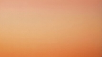 Obraz premium A gentle gradient of soft orange fills the space, evoking a tranquil ambiance perfect for artistic inspiration or relaxation, resembling a sunset glow