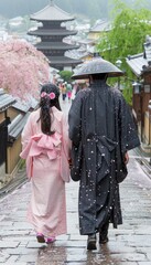 Obraz premium Couple walks hand in hand through cherry blossom path in historic Kyoto during light snowfall