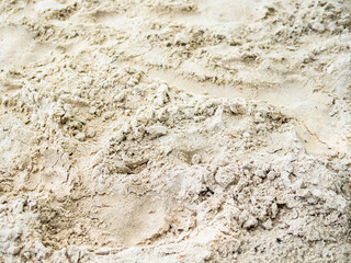surface of fine light brown river sand on beach