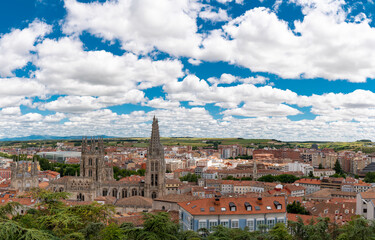 Rooftops of Burgos city. View of Burgos Cathedral and historic city center. Spectacular Cathedral baroque architecture. Cloudy day. Famous travel destination in Spain.