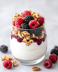 Delicious parfait with yogurt, topped with fresh berries and crunchy granola, perfect for a healthy breakfast or dessert.