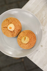 Choux au Craquelin french pastry or cream puff dessert on a plate
