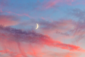 sunset in the clouds with moon
