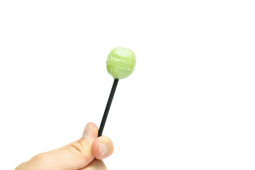 Male hand holding lollipop isolated on white background