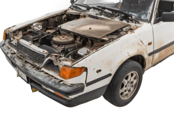 An abandoned rusted car isolated on white background with clipping path.