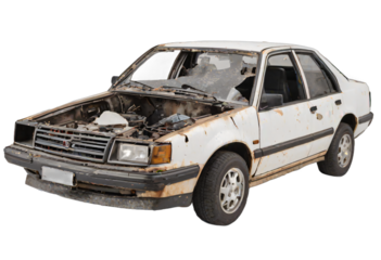 An abandoned rusted car isolated on white background with clipping path.