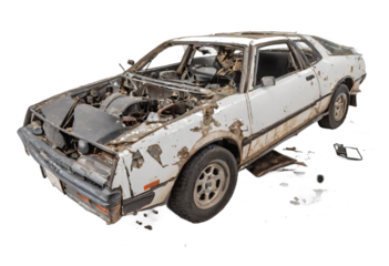 An abandoned rusted car isolated on white background with clipping path.
