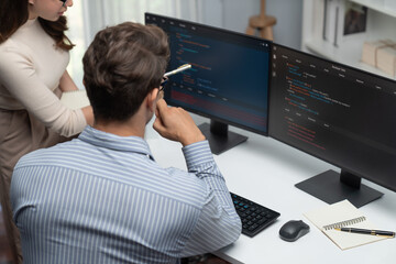 Team skilled developers program coding discussing creative website planning software project on two...