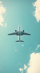 Airplane flying high overhead against a clear blue sky