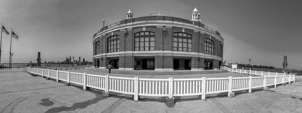 Tourists and locals relax at Navy Pier on a beautiful summer day. Panoramic view - Powered by Adobe