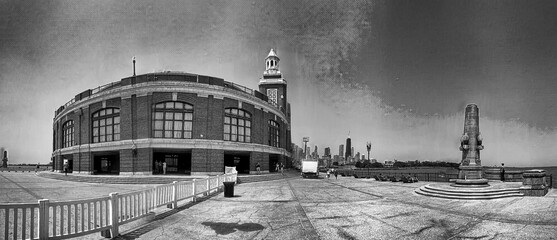 Tourists and locals relax at Navy Pier on a beautiful summer day. Panoramic view