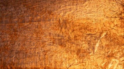 Abstract background with golden metal texture and scratches