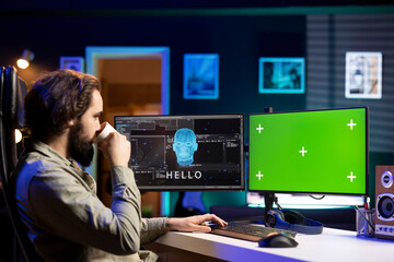 Software developer drinking coffee, watching AI on green screen PC gaining consciousness. Computer...